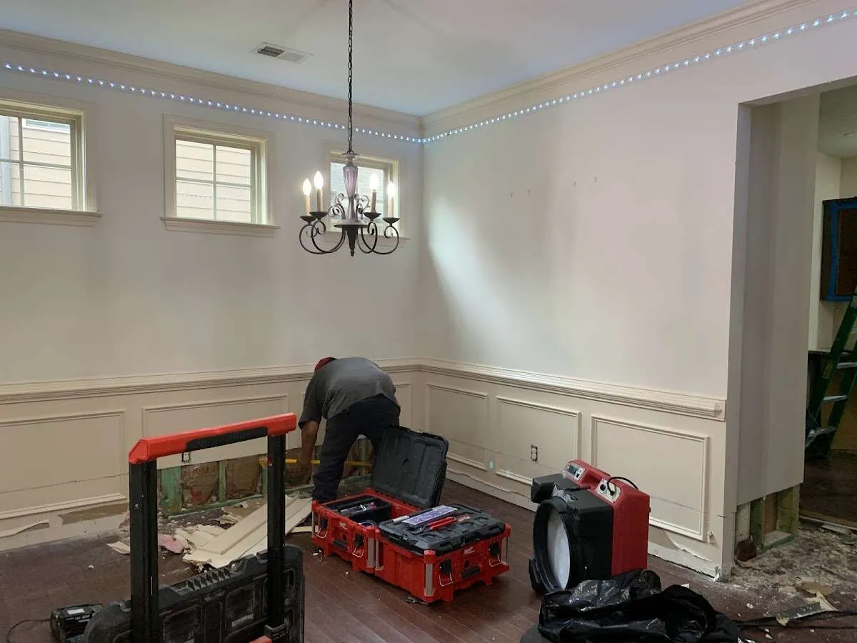 Restoration technician with professional equipment in New Bedford